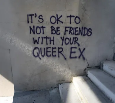 A picture of a graffiti drawn on a white wall with steps in front to address the stereotype and pressure in queer dating in India of staying friends with exes