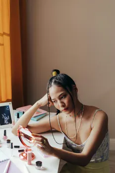 A woman browsing through beauty products of various categories, thanks to the democratisation of beauty in India
