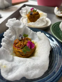 A picture of Peyaj posto bites, a modern take on ingredients found in authentic Bengali food--posto and onion.
