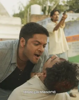 A still from the show Mirzapur, where one person is literally asking the other one to use offensive language, while using sexist language themselves with the word bhenchod, showing how shows have popularise gendered cuss words