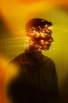 A man's face covered with AI algorithms, reflecting the rise of AI in India