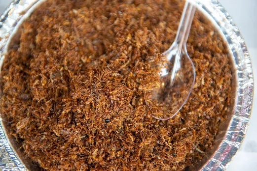 A picture of a plate of a dry chutney, a regional Indian condiment made using red ants to show how traditional Indian condiments came to be due to need for nutrition, not just flavour