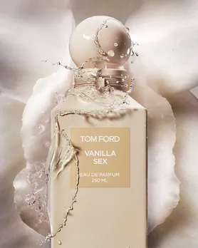 Tom Ford Vanilla Sex perfume with a white floral background