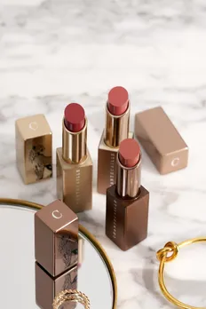 Chantecaille's creamy matte lipsticks placed on a marble trinket tray