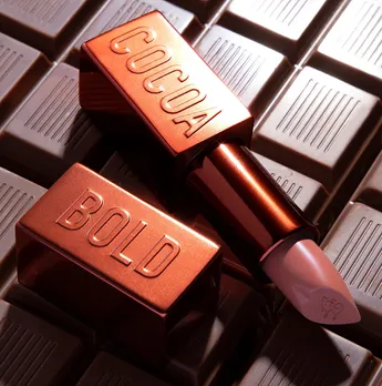 Cocoa bold creamy matte lipstick placed on chocolate bars