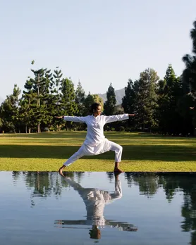 A woman practising yoga, reflecting the rise of wellness in India