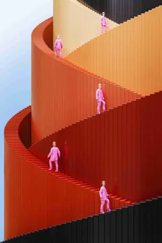 Several Type-A personality individuals dressed in pink climbing a tower coloured in red, yellow and orange