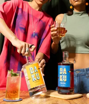 A picture of two people making drinks using Daku Rum's Silver and Gold rums, which are white and dark rums to show the difference between dark rum and white rum India, besides the advent of premium rum brands India and craft rum India.