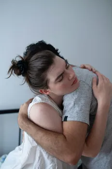 A picture of a man and a woman hugging, to show how cushioning in dating could about harmlessly but does leave someone hurt given that it's emotional cushioning