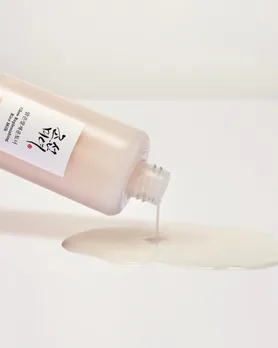 Milky toner flowing out of the beauty of joseon bottle