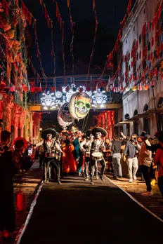A picture of a street decorated for the day of the dead celebration via Mexican art in India which also establishes India and Mexico cultural connection