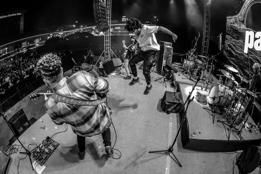 A picture of a band rocking it out on stage to show the rise in indie music festivals in India, including one dedicated to the local rock scene