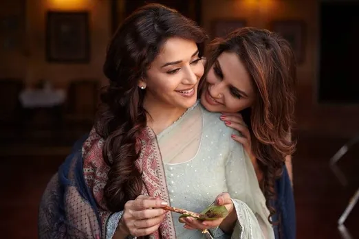 A picture of two women --Madhuri Dixit and Huma Qureshi--hugging each other to represent Bollywood queer stories which have emerged in the last few years but fall flat in light of queer rewritings of Bollywood films