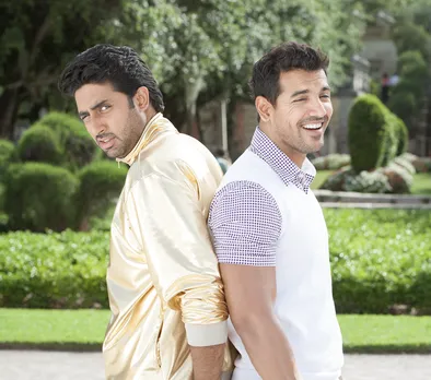 A picture of John Abraham and Abhishek Bachchan in Dostana, a film that wasn't exactly queer romance in Bollywood but the most one could expect of queer Indian storytelling given the lack of queer Bollywood fanfiction