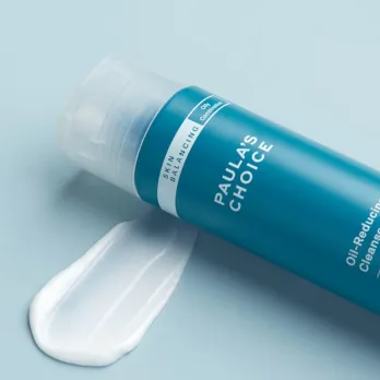 A blue bottle containing non foaming cleanser