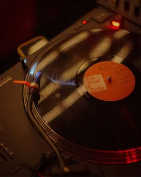 A picture of vinyl records in India on a record player at Middle Room Bangalore to show how accessibility to vinyl record players India is leading to an increase in community spaces India music
