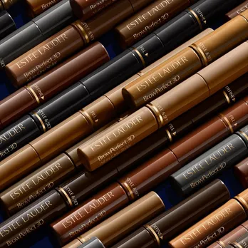 The 3-in-1 eyebrow styler from Estée Lauder in various shades placed closely next to one another