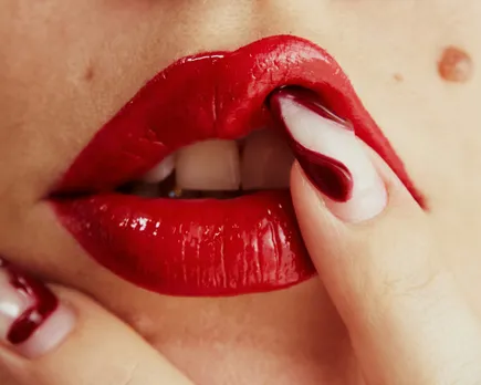 A picture of a woman's red lips to show how ChatGPT erotica in India is leading to digital intimacy India and AI relationships, making AI mental health India and consent and AI a safety concern