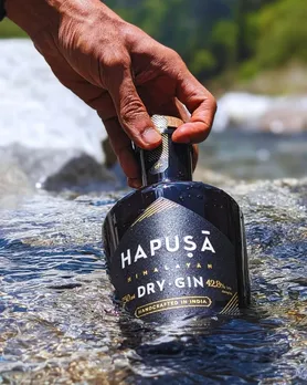A bottle of Hapusa dry gin dipped in a river to depict the rising popularity of Indian craft gins worldwide, besides the growing interest in Indian botanical gins and premium Indian gin