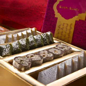 A picture of a box of different cashew-based Indian sweets considered premium Indian mithai popular as Indian gifting sweets, especially when it comes to Kaju Katli in India