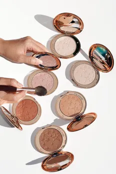 Charlotte Tilbury highlighter powder pan in shades of rose pink, champagne and gold