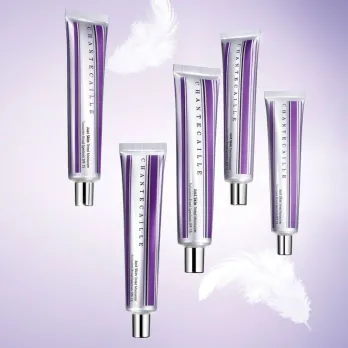 Five silver and purple tubes of Chantecaille skin tint