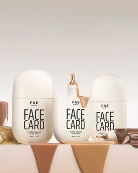 A few bottles of the Fae Beauty face card skin tint with product spilled out of the packaging