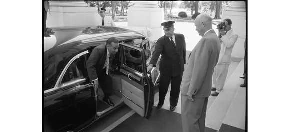 Prime Minister of Pakistan Huseyn Shaheed Suhrawardy, getting out of a car at the White House and being greeted by President Dwight Eisenhower