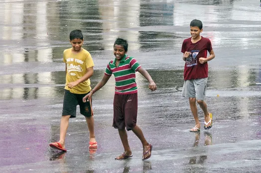 Children seen playing during rain in Lucknow