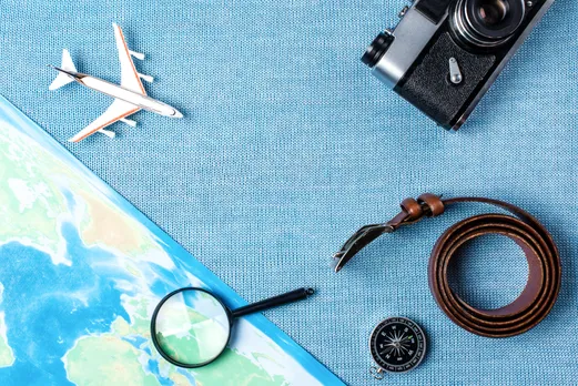 travel-accessories-on-blue-knitted-background-tra-2024-10-18-08-48-22-utc (1)