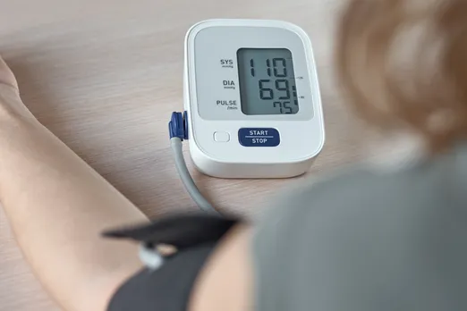 woman-measuring-blood-pressure-with-an-electric-di-2025-03-15-22-12-15-utc