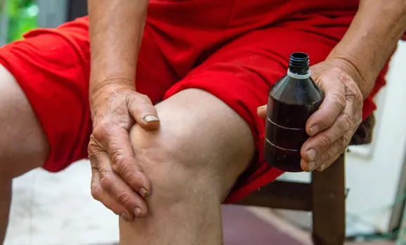 grandmother-treats-her-knees-smears-the-medicine-2025-11-21-22-54-06-utc