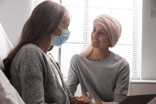 female-patients-talking-hospital-indoors-scaled .