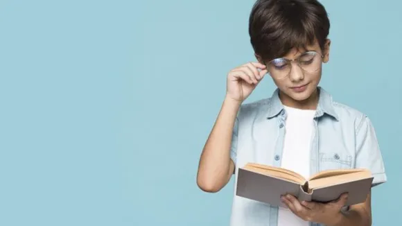 kid reading book (Pinterest).png