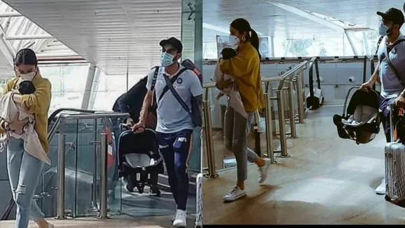 बेटी वामिका के साथ अनुष्का और विराट एयरपोर्ट पर दिखे