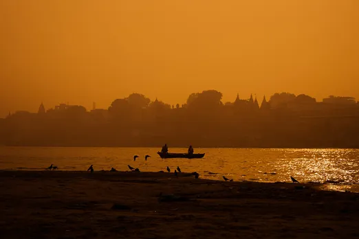 Unsplash_A boat sailing in the Ganges River in Varanasi, India during golden hour_Nayan Bhalotia