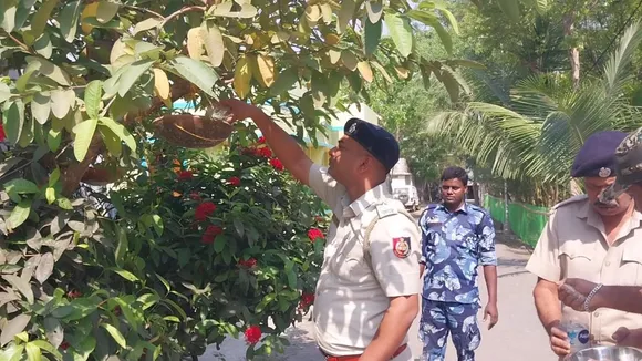 Kultali Policemen arrange food and water for birds on tree branches,কুলতলি