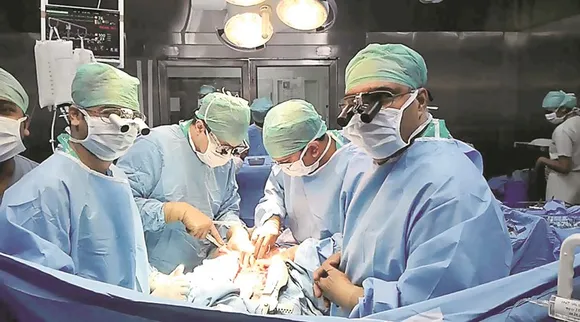 Cardiac surgeon performing heart transplant
