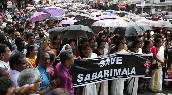 Women chant hymns during a protest called by various Hindu organisations against the lifting of ban by Supreme Court that allowed entry of women of menstruating age to the Sabarimala temple, on the outskirts of Kochi