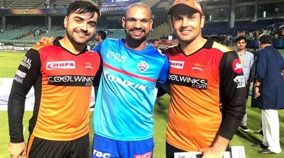 Shikhar Dhawan with two afgan cricketers