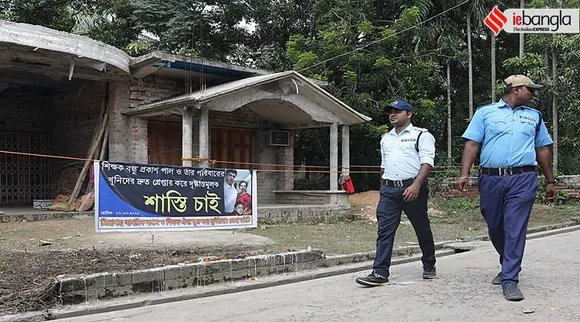 Civic volunteer outside Closed house of Bandhu Prakash Paul. The bodies 35 year old Bandhu Prakash Pal along with his wife Beauty and son Arya were found dead at this in Jiaganj, Murshidabad on Tuesday.Express photo by Partha Paul.Jiaganj.11.10.2019.