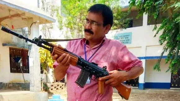 Head master picture with gun in hand is viral