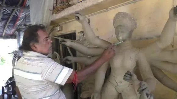 Haldias resident Noor Mohammad Chowdhury makes durga idol for many years