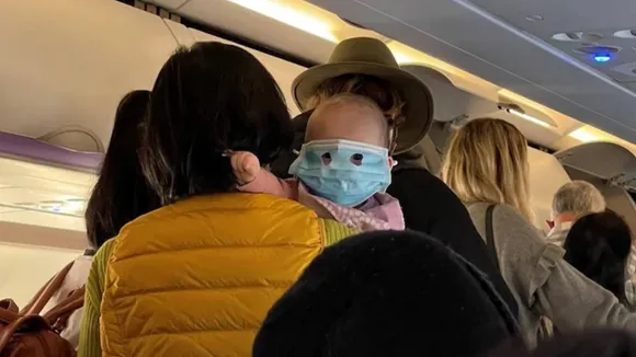 baby,baby pic,baby mask,baby mask flight,baby viral,viral news,viral pic,COVID-19,Face mask,Flight,Mask,New Zealand