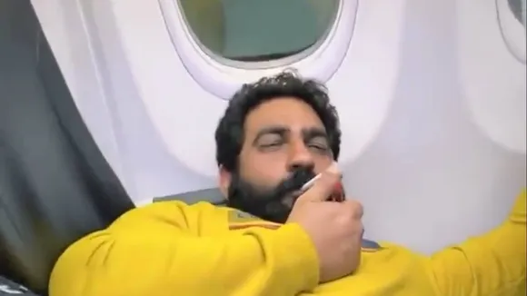 bobby kataria smoking on plane video, bobby kataria smoking on plane case, bobby kataria lookout circular, bobby kataria spicejet controversy, bobby kataria delhi police case, smoking on plane video case, social media influencer bobby kataria, delhi news, indian express