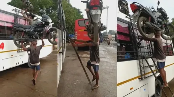 bahubali,netizens,react,man,climbs,roof,bus,bike,head,Twitter,viral video,man climbs with bike