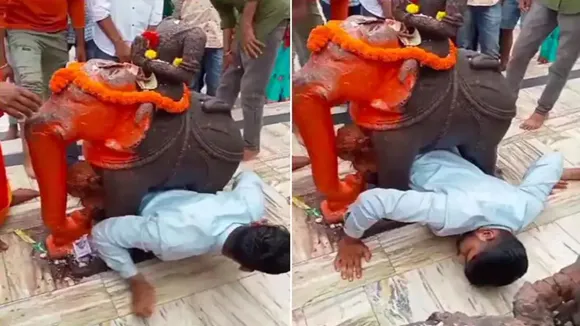 trending Video, viral video, Gujarat viral video, temple viral video, man stuck under elephant statue in temple, trending rescue video, funny video, bhakt ka video