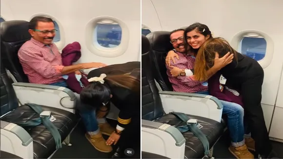 "video of pilot's daughter went viral, pilot doughter, female pilot touching father’s feet, pilot beti with father in flight, daughter took flight after taking father's blessings, Blessing before take off, Capt. Krutadnya Hale, airline pilot, AJAB GAJAB NEWS, KHABRE JARA HATKE, VIRAL NEWS, OMG, WEIRD NEWS"/