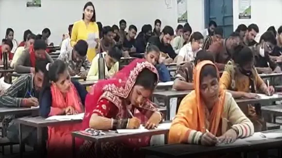 bride in exam center, bride giving exam, trending news, viral news, bride news, bride education, viral news