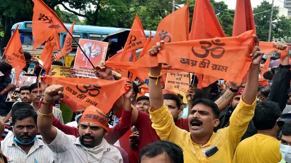 VHP supporters raise slogans during a protest against the killings of minorities